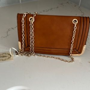 Beautiful new with Tags Isabelle brown and gold vegan leather handbag! Details